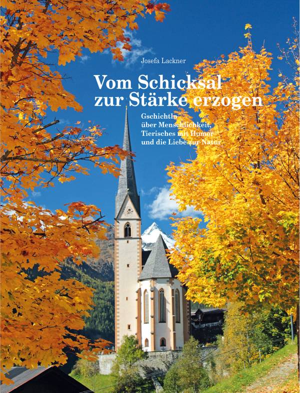 Ein Bergdorf mit einer Kirche, umgeben von buntem Herbstlaub und majestätischen Bergen im Hintergrund.
